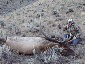 Sarah, in 2012, with a bull elk she harvested opening day. 